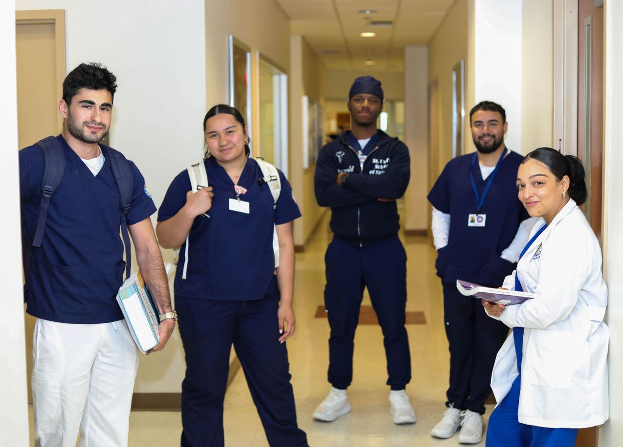 Medical professionals gathered in hospital hallway