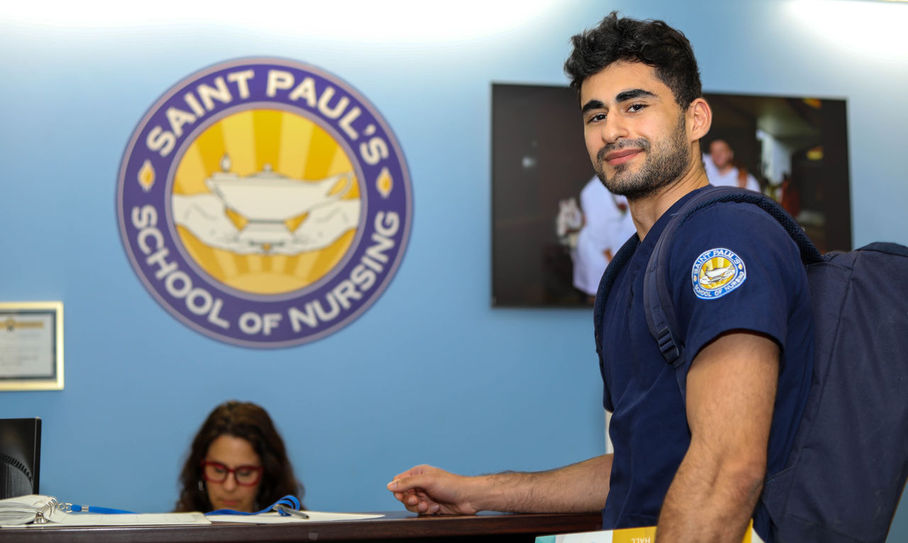 Nursing student at Saint Paul's School reception desk