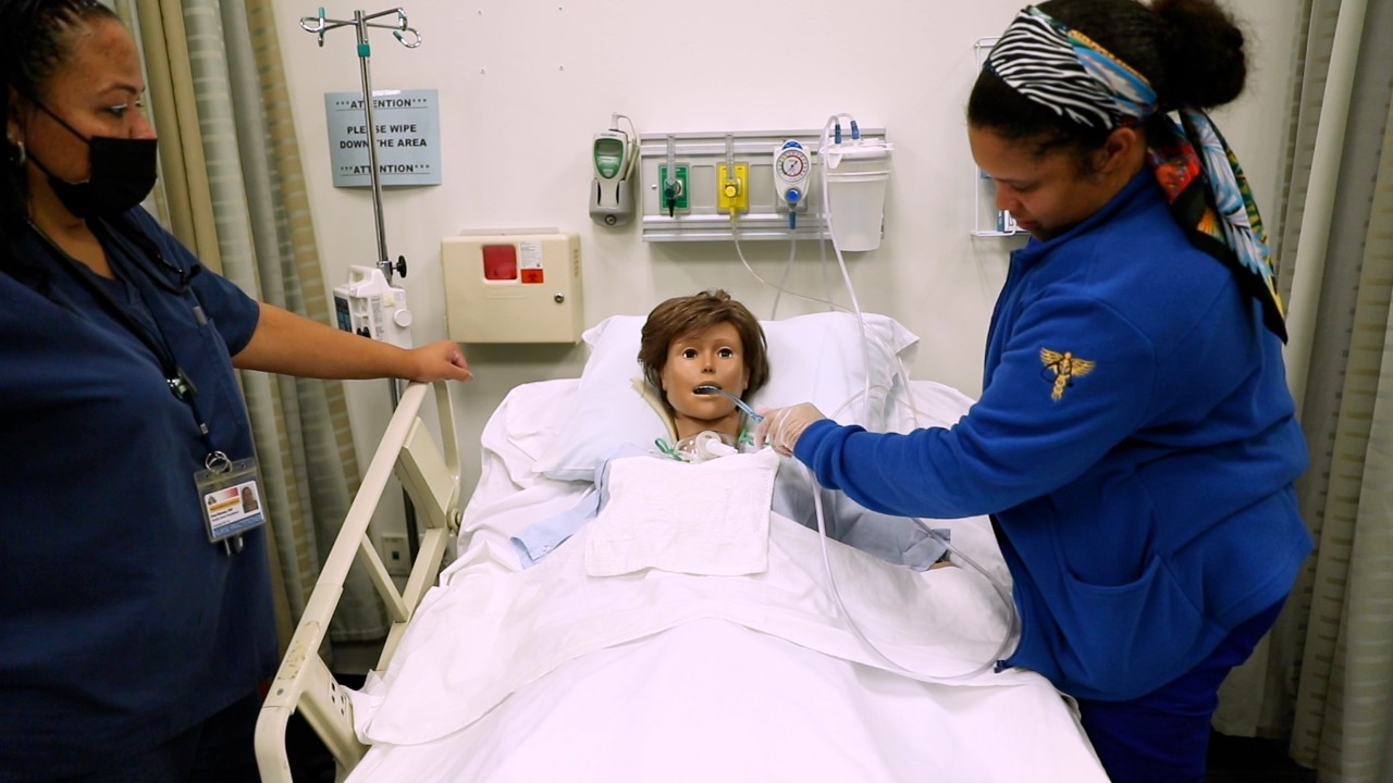 nursing students with manikin